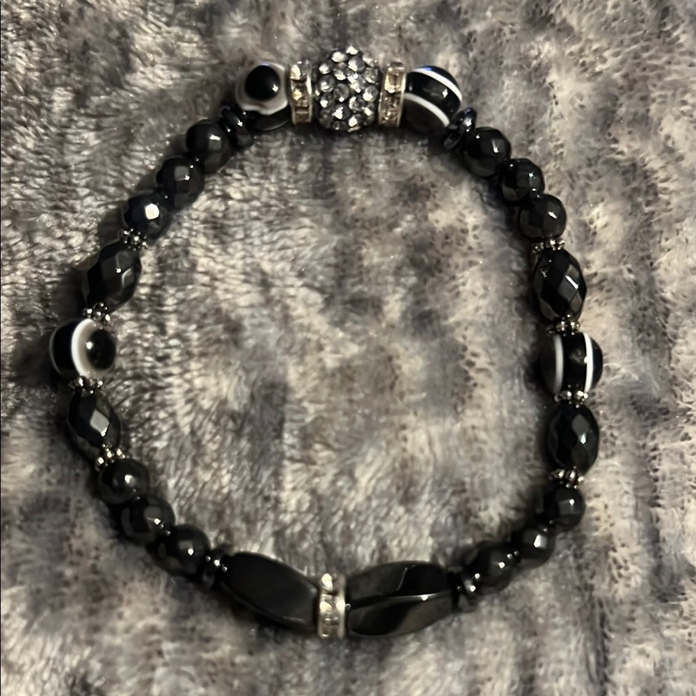 Hematite and Silver Beaded Bracelet w/ evil eye stone w /Intricate Centerpiece.